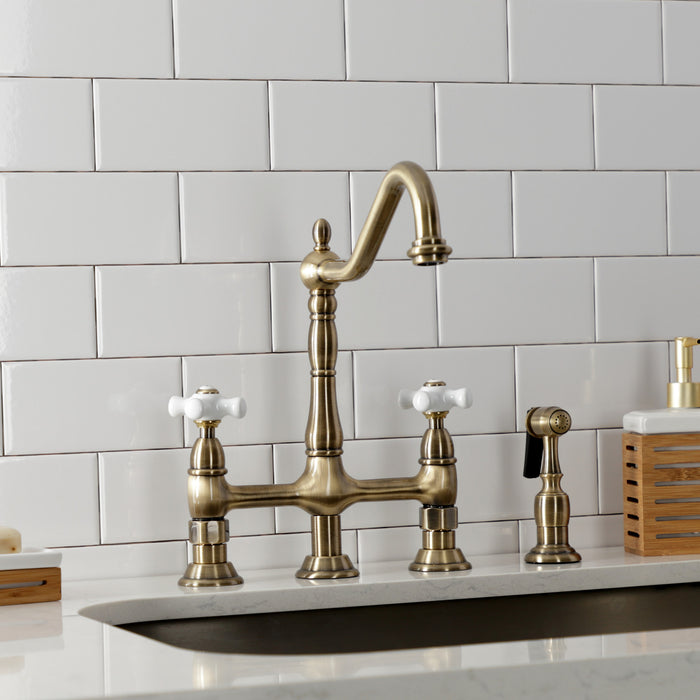 Kingston Heirloom KS1273PXBS - Heritage Two-Handle 4-Hole Deck Mount Bridge Kitchen Faucet with Brass Sprayer, Antique Brass