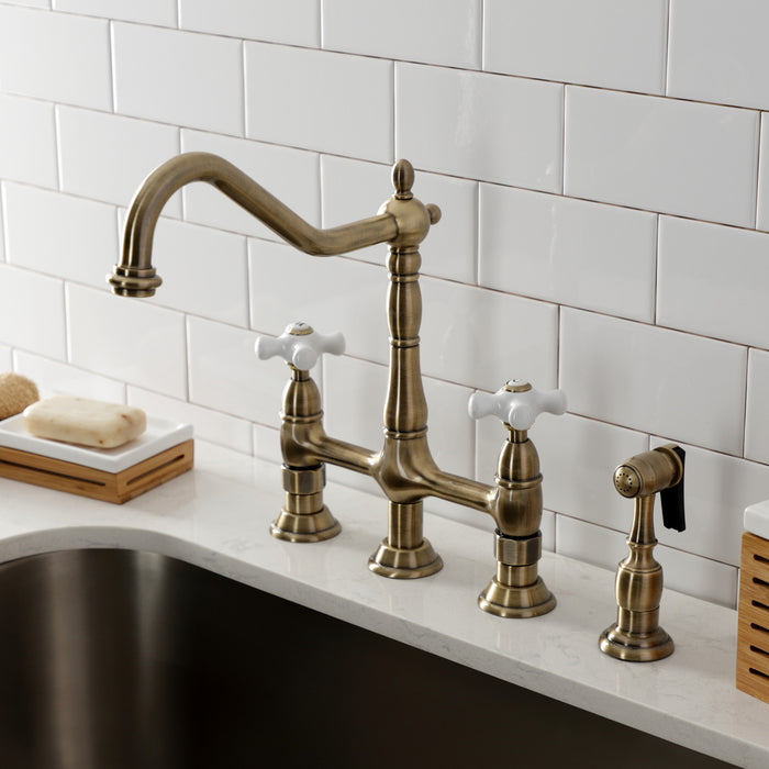 Kingston Heirloom KS1273PXBS - Heritage Two-Handle 4-Hole Deck Mount Bridge Kitchen Faucet with Brass Sprayer, Antique Brass