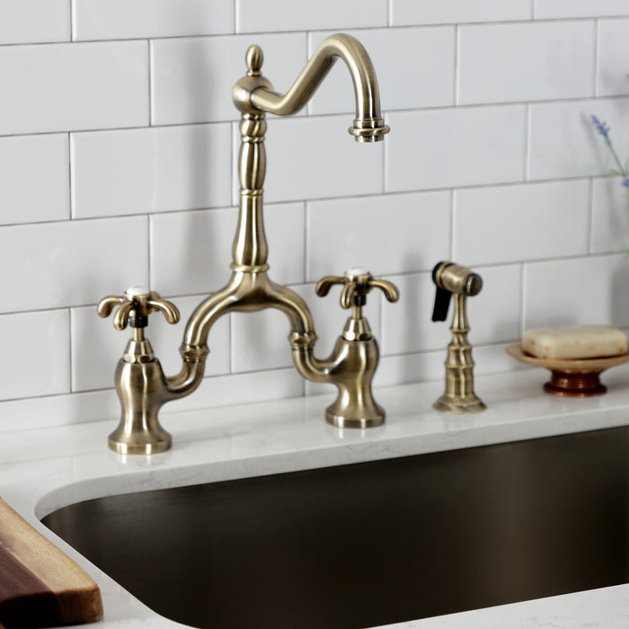 Kingston Heirloom KS7753TXBS - French Country Two-Handle 3-Hole Deck Mount Bridge Kitchen Faucet with Brass Sprayer, Antique Brass