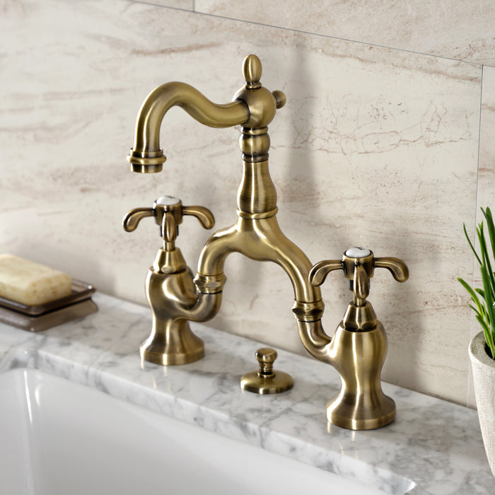 Kingston Heirloom KS7973TX - French Country Two-Handle 3-Hole Deck Mount Bridge Bathroom Faucet with Brass Pop-Up, Antique Brass